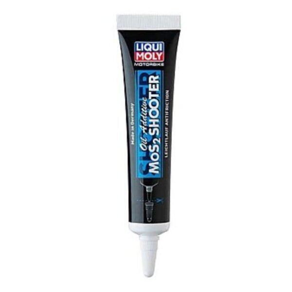 Small tube of Liqui Moly Motorbike MoS2 Shooter engine oil additive placed on a motorcycle engine, symbolizing friction reduction and enhanced engine protection.